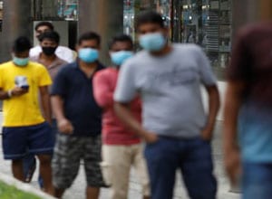 blurry photo of six indian men in surgical masks